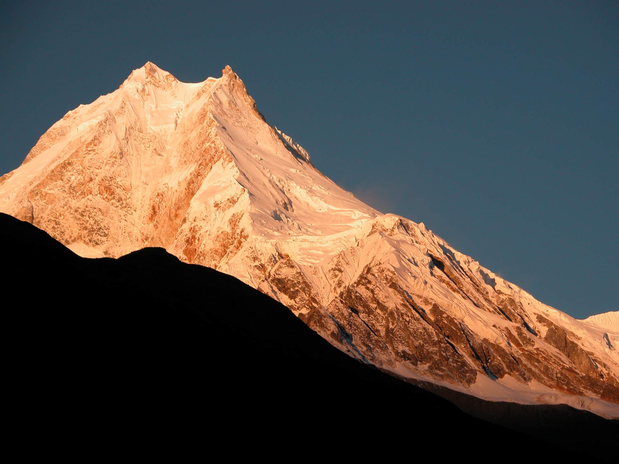 Manaslu 07 03 Manaslu Medium Shot Sunrise From Syala Wow! The subtle changes of the light on Manaslu are terrific. Manaslu (8156m) is said to derive from the Sanskrit word Manasa, which means soul; therefore Manaslu is the Mountain of the Soul. It was earlier known as Kutang I, while the Survey of India�s symbol was merely Peak XXX. According to Snelgrove, the local Tibetan name for Manaslu is Pung-gyen, which is also the name to the god who resides on it.